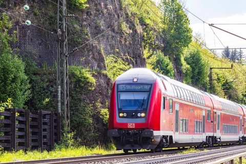 Regional express RE5 en route on the winding railway line of the Geislinger Steige. Landscape along