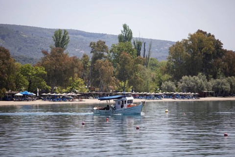 Fishing boat in the Pagasitic Gulf, behind the beach of Kala Nera, Pelion or Pelion Peninsula,