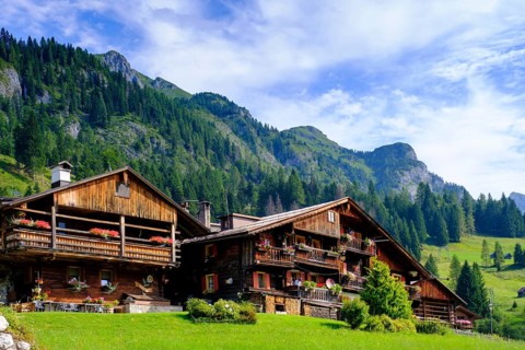 Old farmhouses in the hamlet of Kratten, Sappada, Plodn, Carnic Alps, Julian Friuli, Italy