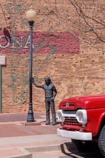 Statue of a man Standin' on a Corner in Winslow Arizona as sung in the classic Glenn Frey and