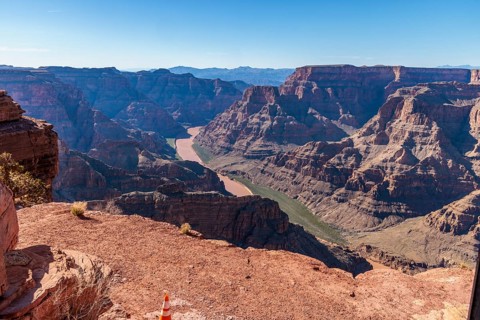 Colorado River runs between rock formations at Guano Point in Grand Canyon West near Peach Springs,