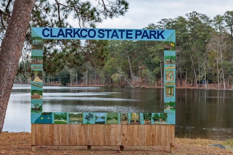 Permanent painte wooden photo prop beside Lake Ivy at Clarko State Park near Quitman, Mississippi,