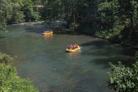 Rafters on the Nantahala River as seen from the Great Smoky Mountains Railroad which runs next to