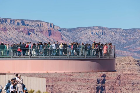 Visitors view the Grand Canyon from the Skybridge, a glass floored bridge extending 70 feet over