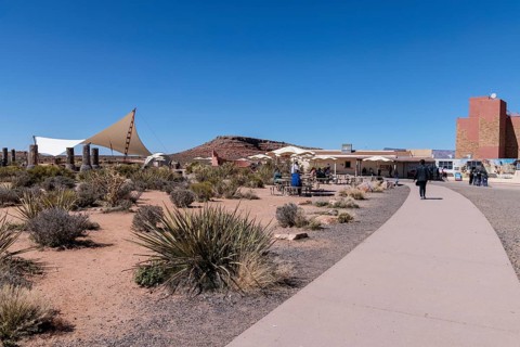 Umbrella shaded tables and a large awning provide visitors shade from the desert sun at Eagle Point