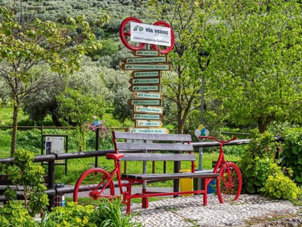 Decorated signpost, cycle path Via Verde Del Aceite, village Dona Menica, Andalusia, Spain