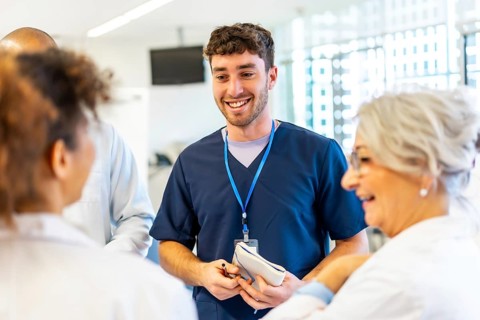 Doctors and nurses collaborating, sharing expertise, and coordinating patient care in a modern