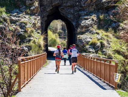 People on the Tranvía de Sierra Nevada, former railroad track, leading to the trail Vereda de la