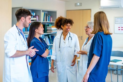 Diverse medical professionals collaborating, sharing expertise, and strategizing for optimal