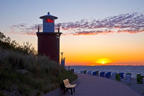 Olhörn lighthouse at colourful sunrise over the sea on the North Frisian island of Föhr,
