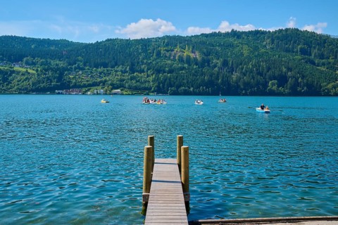 Lake shore, wooden jetty, rowing boats, summer, Lake Millstatt, Millstatt, Carinthia, Austria