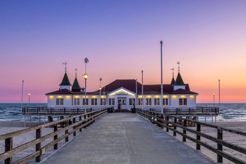 Restaurant on Ahlbeck Pier/ Seebrücke Ahlbeck in the Baltic Sea at sunrise on Usedom island,