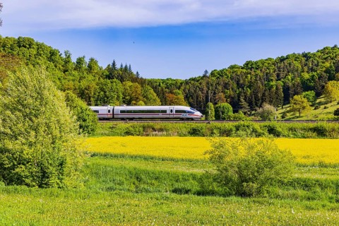 InterCityExpress ICE travelling across the Swabian Alb. Idyllic landscape in spring. Lonsee,