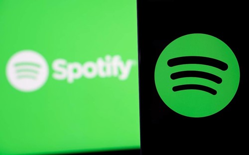 Spotify logo is seen on a smartphone
