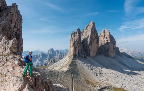 Hiker on the via ferrata to Patternkofel, Northern walls of the Three Peaks, Sesto Dolomites, South