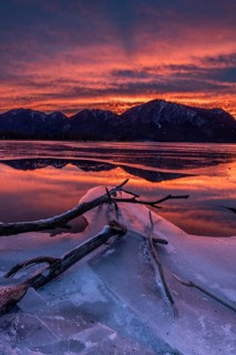 Dawn, mountains reflected in lake, clouds, ice, frozen, winter, Lake Kochel, view of Rabenkopf,