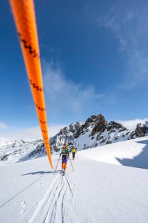 Ski tourer with rope, rope team on the Vadret da Porchabella glacier on the ascent to the summit of