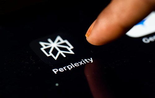 In this photo Illustration a person browsing taps perplexity app icon on a tablet device on 24 May