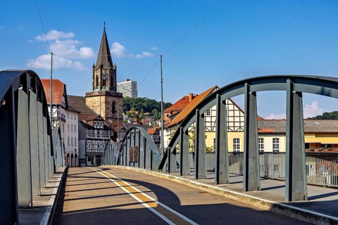 Modern bridge with a view of the church and half-timbered houses, blue sky, The town of Rotenburg