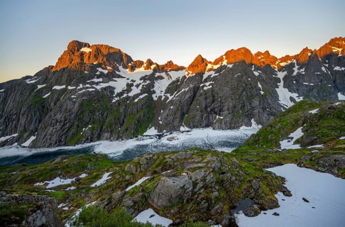 Rocky mountain peaks and Trollfjordvatnet with snow, at the Trollfjord Hytta, mountain landscape