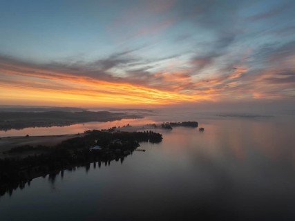 Aerial view of the Mettnau peninsula near Radolfzell on Lake Constance in front of sunrise, on the