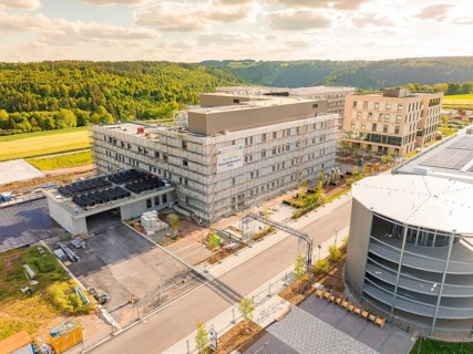 Building complex in a rural setting with several multi-storey buildings and structures,