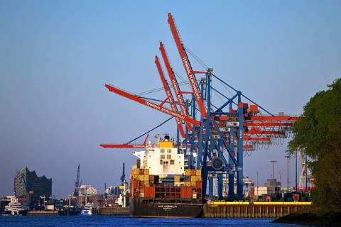 Container ship MSC Cornelia at the Burchardkai container terminal with the Elbphilharmonie concert