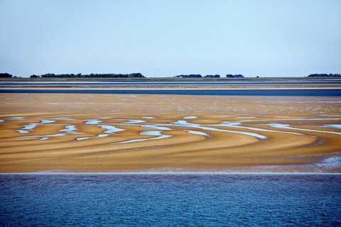 Schleswig-Holstein Wadden Sea National Park at low tide with sandbanks and mainland, North Frisia,