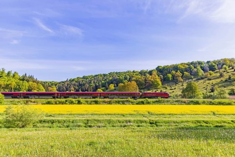 ÖBB RailJet travelling across the Swabian Alb. Idyllic landscape near Lonsee in spring. Lonsee,