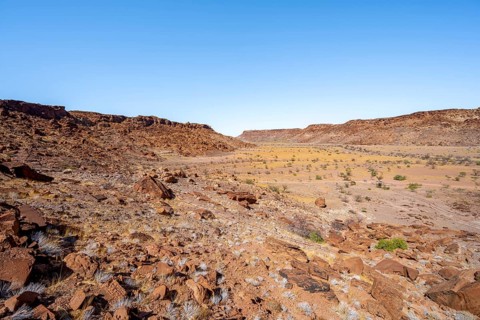 Barren landscape with boulders in a valley, desert landscape, Twyfelfontein, Kunene, Namibia