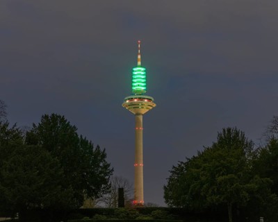 Green illuminated Europe Tower (Frankfurt asparagus) for the Day of Children's Hospice Work,