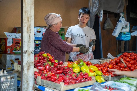 Stall selling vegetables at the Osh Bazaar, Bishkek, Kyrgyzstan