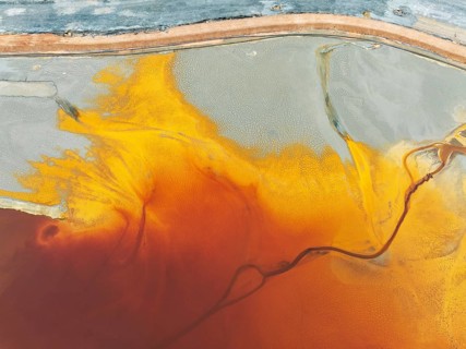 Waste pond in the mineral-rich area of the Rio Tinto mines. The colour is caused by oxidised iron