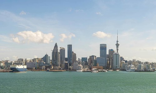 Skyline with modern skyscrapers and harbour against a blue sky Auckland, New Zealand, Oceania