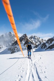 Ski tourer with rope, rope team on the Vadret da Porchabella glacier on the ascent to the summit of