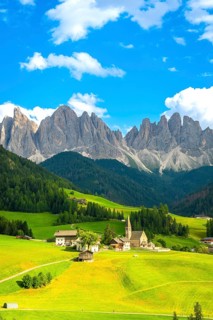 Scenic summer view of st. Magdalena church in val di funes with the odle mountain range in the