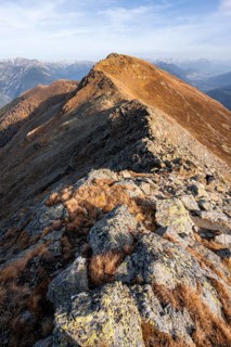 Venet ridge with Kreuzjoch summit, view from the Venet ridge to mountains of the Parzinn group in