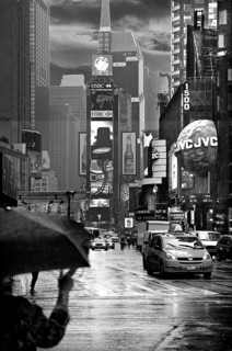 Evening Times Sqaure with illuminated advertising in the rain, New York City, USA