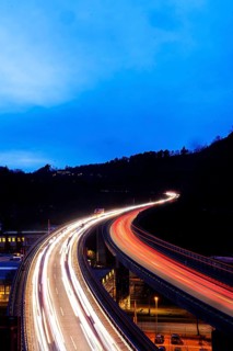 Federal road B14 in the evening, road bridge with traffic and light traces. Long exposure.