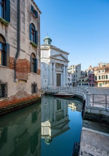 Church Chiesa di Santa Maria Maddalena, reflected in the canal, Cannaregio, Venice, Veneto, Italy