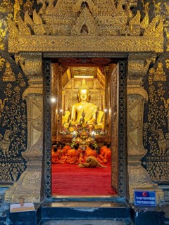 Buddha image at Wat Xieng Thong Sim ordination hall, Luang Prabang, Laos