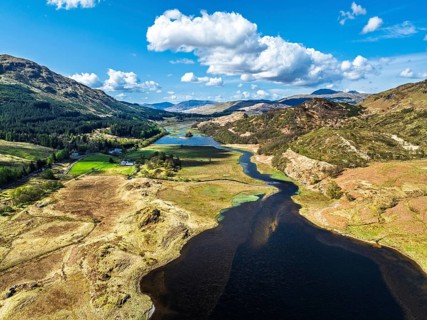 Mountains over Loch Iubhair from a drone, Crianlarich, Highlands, Scotland, United Kingdom