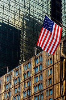 Reflections in glass facades, us national flag, stars stripes, Manhattan, New York City, USA