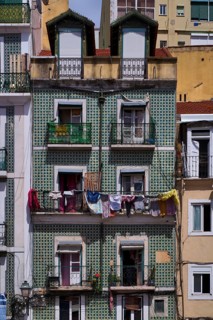 Residential building, house facade, narrow, azulejos, tiles, tile decoration, laundry for drying,