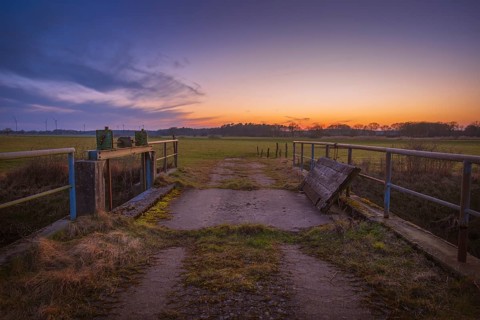 View of a sluice and a bridge with a pasture behind it at sunset, Kirchlinteln, Verden, Aller Leine