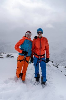Two ski tourers, couple on the summit of the Köllkuppe or Cima Marmota, snow-covered mountain