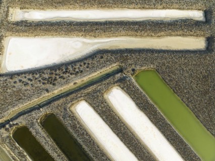 Saline ponds at the salt works near Chiclana de la Frontera. Aerial view. Drone shot. Cádiz