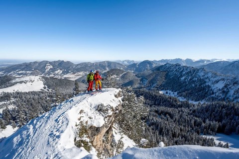 Two ski tourers on a mountain ridge, on the ascent to the Teufelsstättkopf, snowy mountain