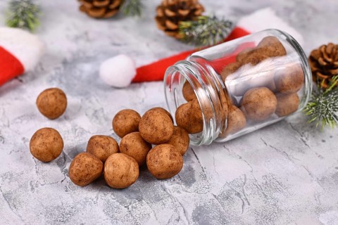 Traditional German Christmas sweets called Marzipankartoffeln. Round ball shaped almond paste