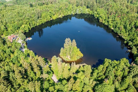 Lake Bergsee ('mountain lake') near Bad Säckingen, island in the lake, boat dock of rental boats,